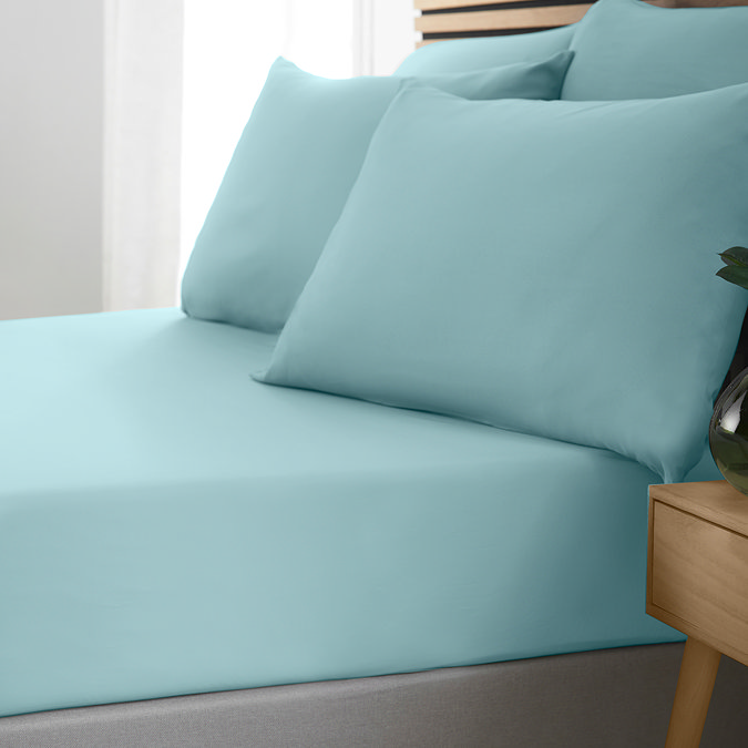 side-on image of duck egg blue coloured fitted sheet with matching pillowcases