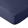close up on corner of mattress with navy blue fitted sheet, image cut out on white background