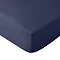 close up on corner of mattress with navy blue fitted sheet, image cut out on white background