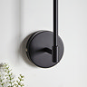 close up on matt black arm of wall light