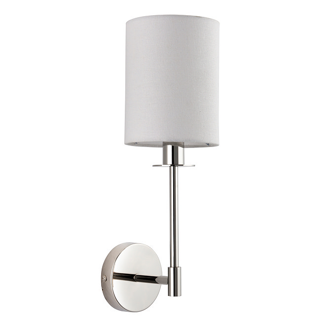 image cut out on white background of wall light with cylindrical fabric shade and nickel arm
