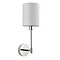 image cut out on white background of wall light with cylindrical fabric shade and nickel arm