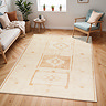 image of ivory rug with beige scandi central pattern, on wood flooring of modern apartment