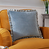 Solene ruffle feather cushion on chair image 1