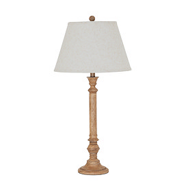 image cut out on white background of tall brown table lamp with edged linen shade