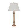 image cut out on white background of tall brown table lamp with edged linen shade
