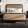 close up image of black bedframe with mole coloured padded headboard