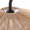 close up on point where black body of floor lamp curves into woven lamp shade