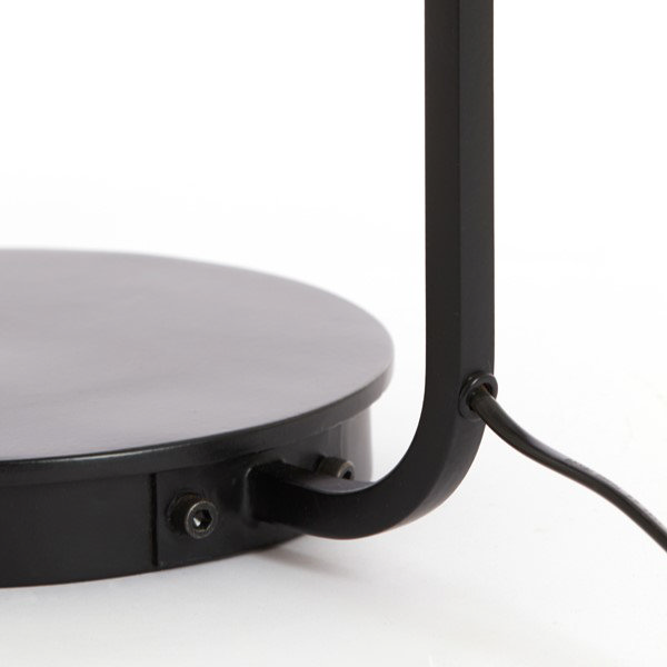 close up on black metal base of table lamp