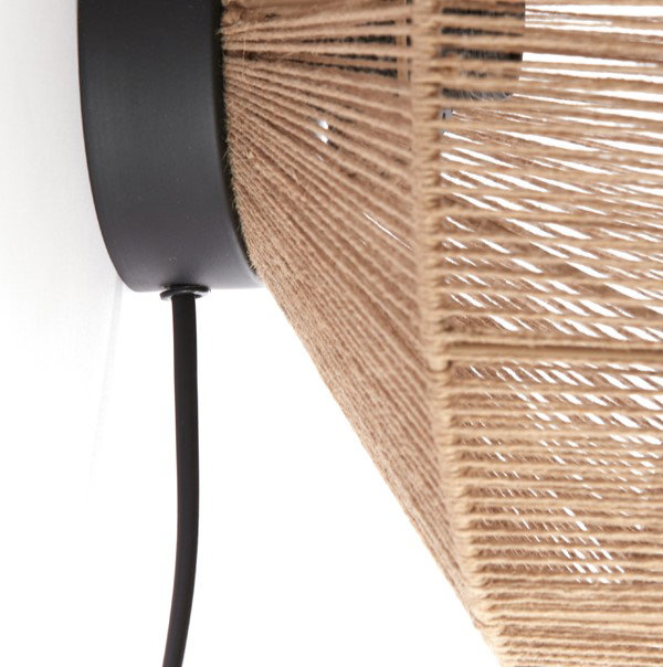 close up image of back of woven natural coloured wall light