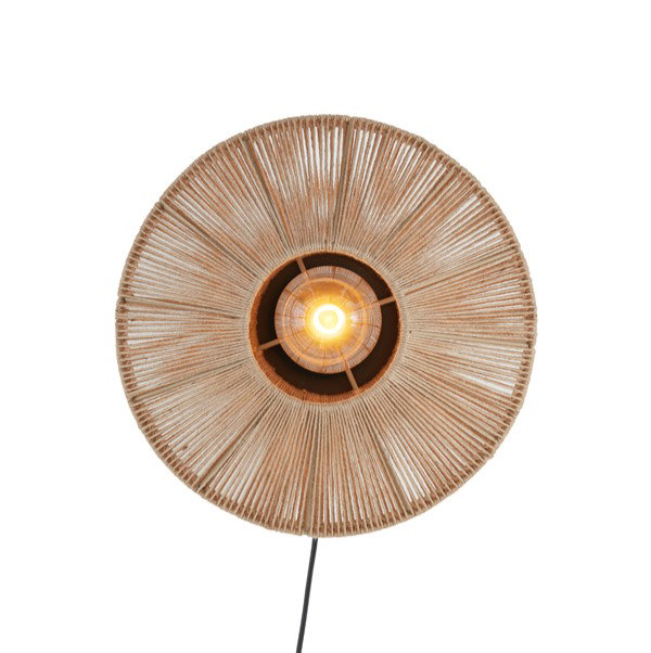 image cut out on white background of circular woven natural coloured lamp with central bulb emitting warm glow
