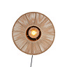 image cut out on white background of circular woven natural coloured lamp with central bulb emitting warm glow