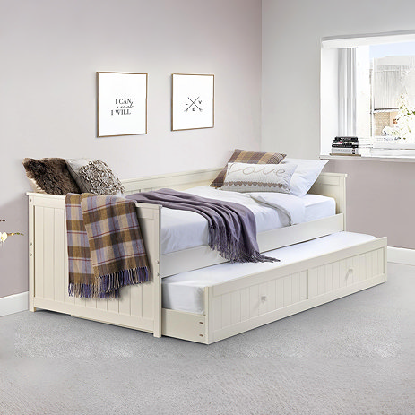 image of ivory day bed with drawer underneath pulled out to show storage solution