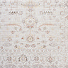 close up zoomed in image of pattern of ivory rug