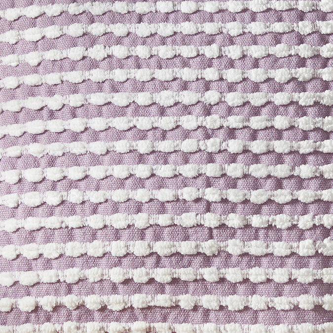 close up of lilac stab stitch cushion in light purple
