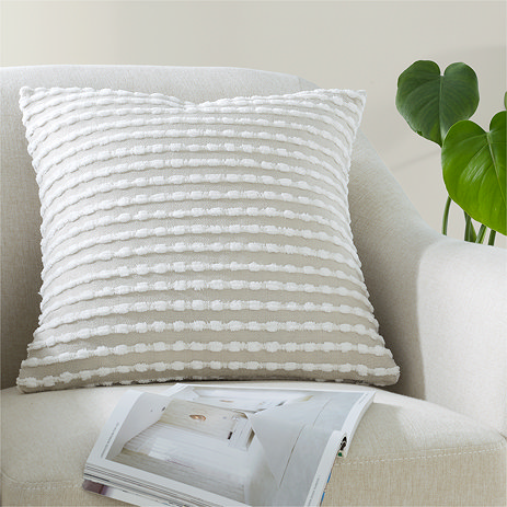 Natural Stab Stitch Cushion on Cream Chair
