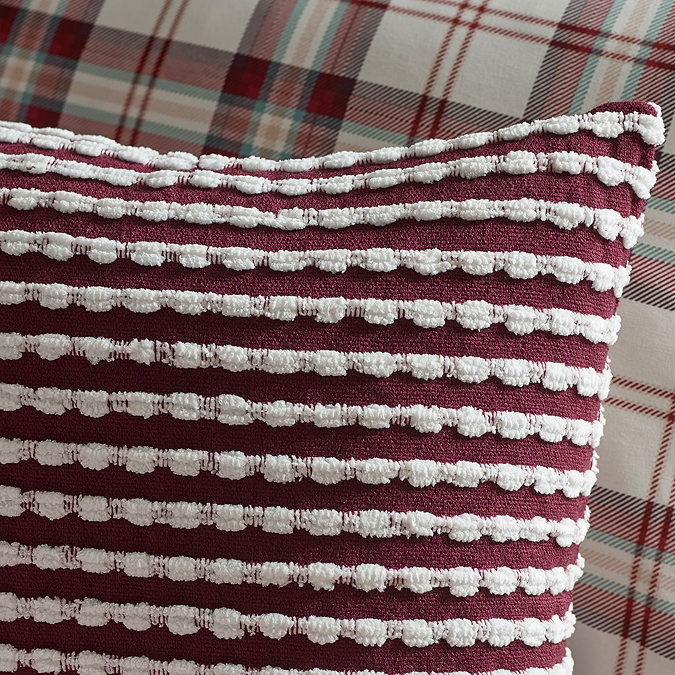 stab stitch cushion in plum