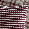 stab stitch cushion in plum
