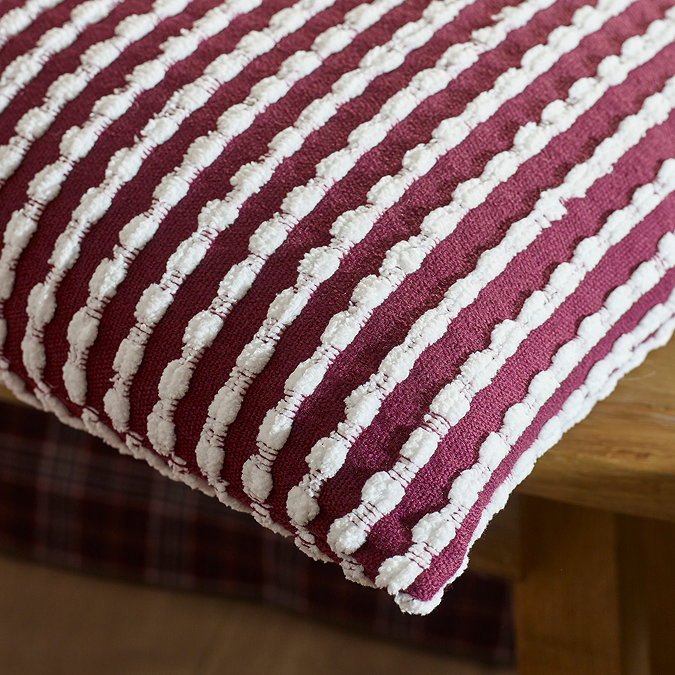 stab stitch cushion in plum