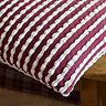 stab stitch cushion in plum