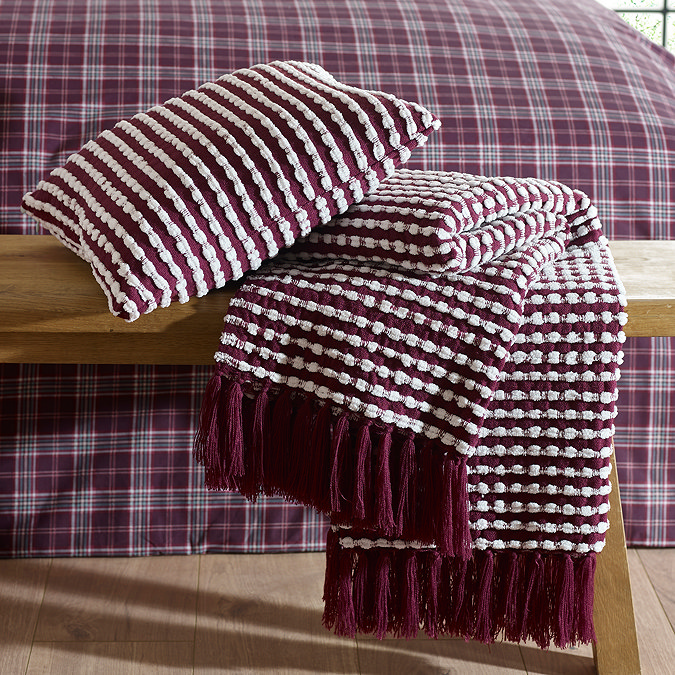 stab stitch cushion in plum