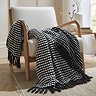 black stab stitch throw draped over a chair