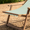 close up image on acacia wood deck chair frame