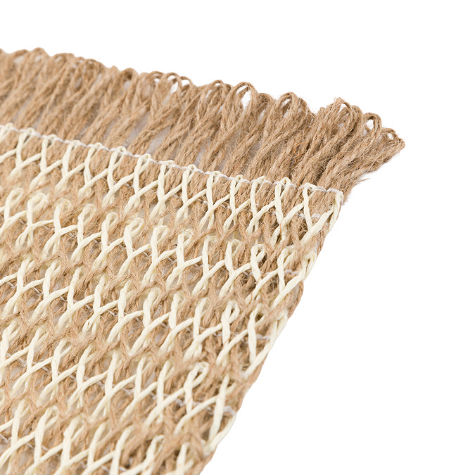 close up image cut out on white background of fringed edge of woven jute placemat