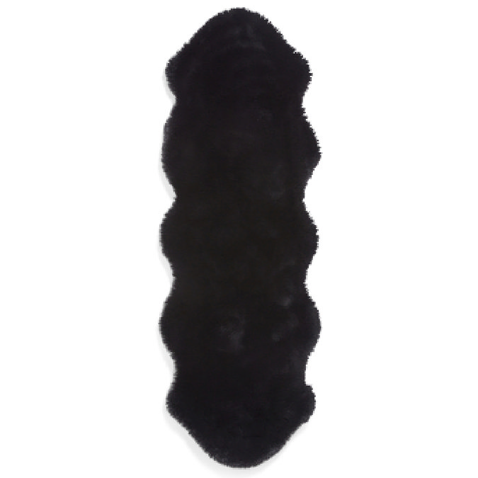 image cut out on white background of long black sheepskin rug with wavy edges