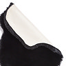 image of black sheepskin rug with corner folded over to show floor-facing material underneath