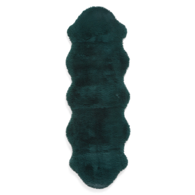image cut out on white background of long dark green rug with wavy edges