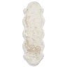 image cut out on white background of long soft ivory rug with wavy edges