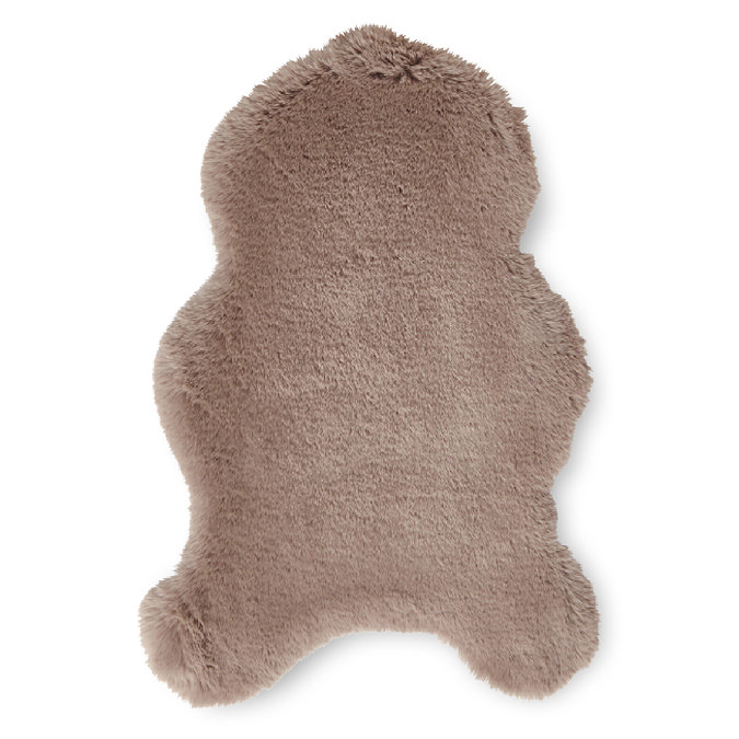 image cut out on white background of short mink brown rug with wavy edges