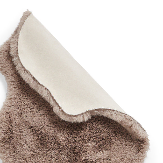 image of mink brown rug folded over at corner to show floor-facing material underneath