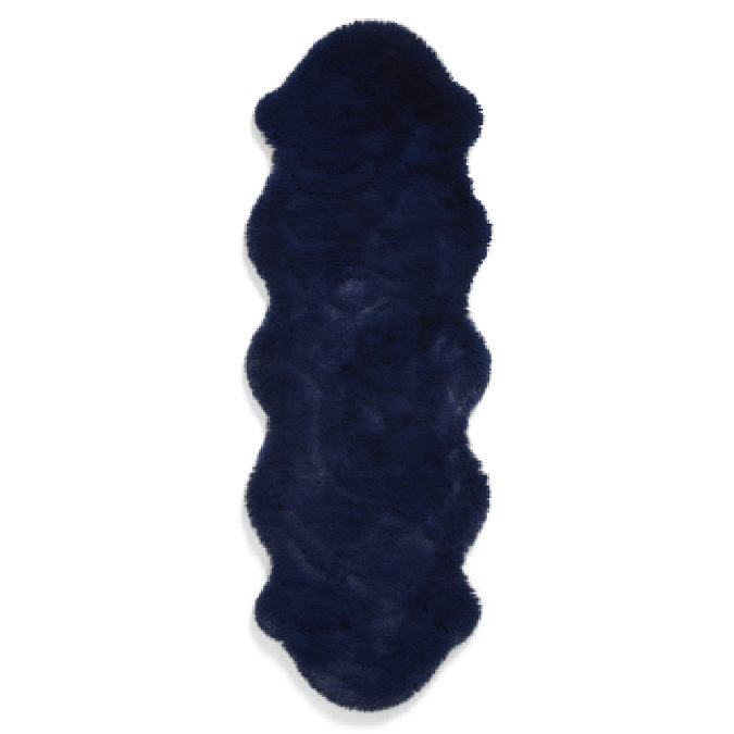 image cut out on white background of navy blue soft rug with wavy edges