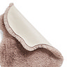 image of rose pink rug folded over in corner to show floor-facing material underneath