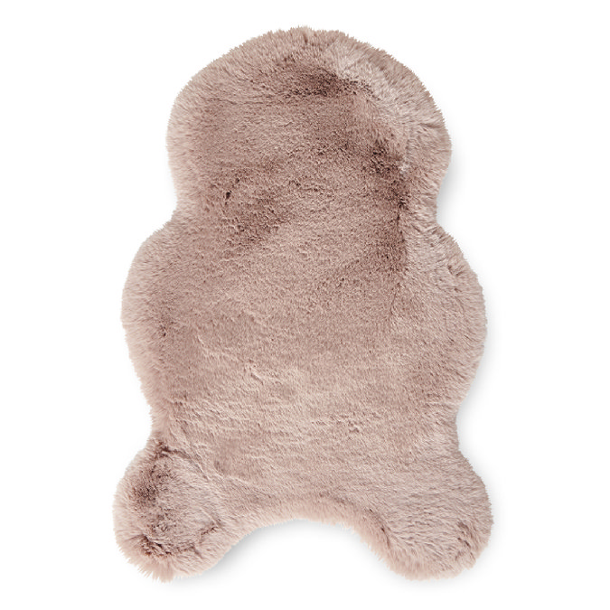 image cut out on white background of short rose pink rug with wavy edges