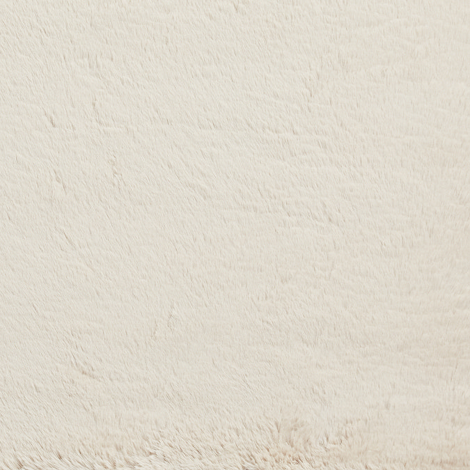 close up on texture and colour of beige super soft rug