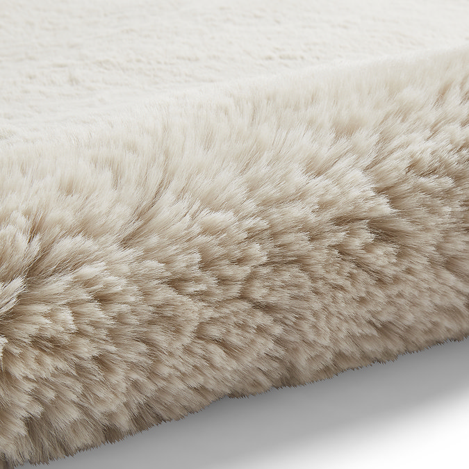 close up image of super soft rug rolled up on one end