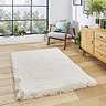 image of soft beige rug in middle of wooden flooring