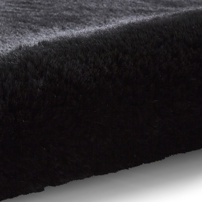 image of soft black fluff rolled up on one end