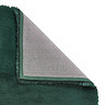 image of emerald green soft rug with corner folded over to show floor-facing material underneath