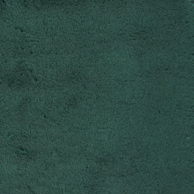 close up on material and colour of soft emerald green rug