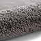 image of soft grey rug rolled up at one end