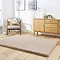 angled image of soft mink brown rectangle rug on wooden flooring in front of wooden sideboard