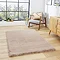 image of mink brown soft rectangle rug on light wooden flooring of modern loft apartment