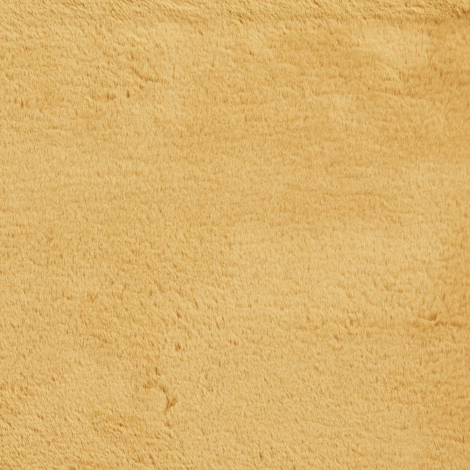 close up on material and colour of soft mustard yellow rug