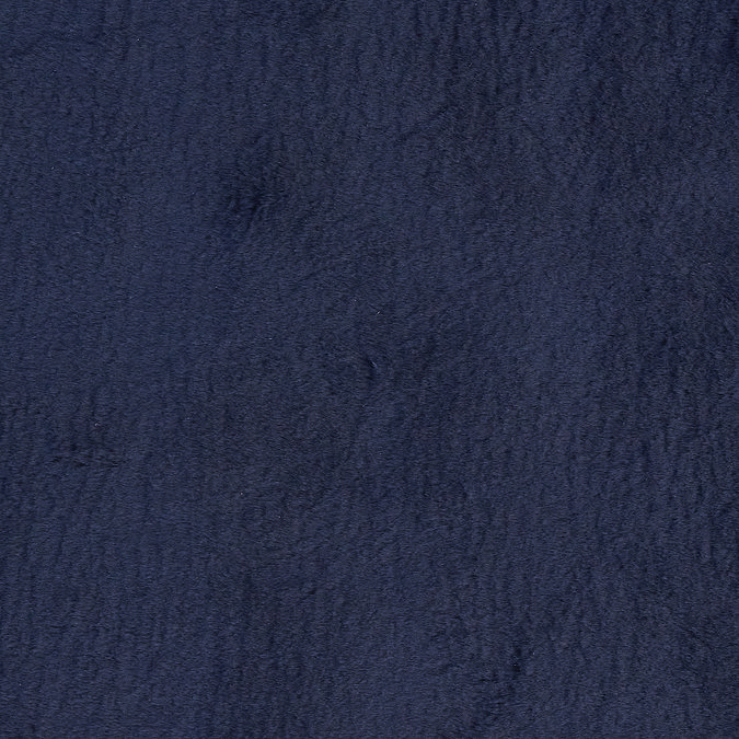 close up on material and colour of soft navy blue rug