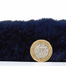 side on image of navy blue rug flat with pound coin stood up next to it to show rug as double height of coin