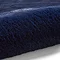close up image of navy blue soft rug rolled up at one end